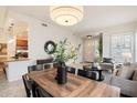 Open-concept living and dining area with tile flooring and modern decor at 10851 E Le Marche Dr, Scottsdale, AZ 85255