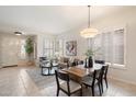 Inviting living room with modern lighting, neutral colors, and open space at 10851 E Le Marche Dr, Scottsdale, AZ 85255