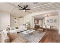 Inviting living room features neutral colors, a modern ceiling fan, and lots of natural light at 11596 W Sierra Dawn Blvd # 157, Surprise, AZ 85378