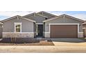 Charming single-story home with neutral paint, stone accents, and a two-car garage at 3649 E Alexander Dr, San Tan Valley, AZ 85143