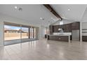 Open-concept floor plan featuring recessed lighting, neutral walls, and a seamless flow to the kitchen at 19964 W Marshall Ave, Litchfield Park, AZ 85340