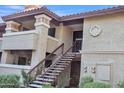 Exterior view of condo building with staircase and Spanish-style architecture at 7557 N Dreamy Draw Dr # 251, Phoenix, AZ 85020