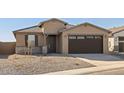 Single-story house with a two-car garage and rock landscaping at 37501 W San Clemente St, Maricopa, AZ 85138
