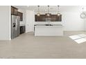 Modern kitchen with stainless steel appliances and an island at 37501 W San Clemente St, Maricopa, AZ 85138