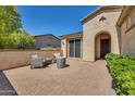 Inviting brick courtyard with seating area, perfect for relaxing at 12368 W Running Deer Trl, Peoria, AZ 85383