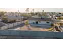 Aerial view of fenced backyard and nearby houses at 323 N 69Th Ave, Phoenix, AZ 85043
