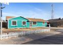 Image of the home highlighting the quaint front yard and exterior paint color at 323 N 69Th Ave, Phoenix, AZ 85043