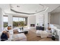 Spacious living room boasts stunning views and a cozy fireplace at 12943 E Corrine Dr, Scottsdale, AZ 85259