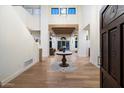 Bright and spacious entryway with hardwood floors and high ceilings at 7628 E Mary Sharon Dr, Scottsdale, AZ 85266