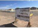Sign showing Luxury Spec Home - Lot A with floorplans and renderings of the exterior at 10784 E Angus Ln, Coolidge, AZ 85128