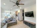 Open living area with a comfortable sectional sofa and large TV at 3559 E Archer Dr, San Tan Valley, AZ 85140
