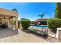 Backyard with patio, pool, and landscaping at 7156 S Forest Ave, Gilbert, AZ 85298