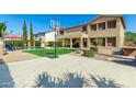 Large backyard with a basketball court and plenty of space for recreation at 7156 S Forest Ave, Gilbert, AZ 85298