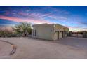 View of home's side elevation, showcasing garage and landscaping at 30813 N 138Th St, Scottsdale, AZ 85262