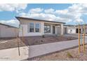Single-story home with light gray exterior and front yard landscaping at 22837 E Alyssa Rd, Queen Creek, AZ 85142