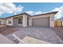 Modern home with gray exterior, paved driveway, and attached garage at 22837 E Alyssa Rd, Queen Creek, AZ 85142