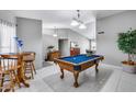 Game room featuring a pool table and comfortable seating area at 19219 N 33Rd Ave, Phoenix, AZ 85027