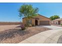 Tan house with brown garage door and landscaping at 25677 W Siesta Way, Buckeye, AZ 85326