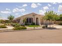 Attractive home showcasing tidy landscaping, colorful window trim, and a neutral color palette at 10331 E Wavelength Ave, Mesa, AZ 85212