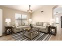 Bright living room featuring neutral sofas, striped rug, and a square wooden coffee table at 10209 W Jessie Ln, Peoria, AZ 85383