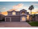 Charming two-story home with a three-car garage, beautiful desert landscaping, and a warm inviting entrance at 760 N Ithica St, Gilbert, AZ 85233