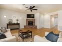 Spacious living room featuring a fireplace and hardwood floors at 21320 N 56Th St # 2159, Phoenix, AZ 85054