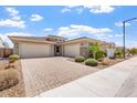 Beautiful single-story home featuring a three-car garage and lush landscaping at 28389 N 131St Dr, Peoria, AZ 85383