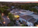 Expansive estate aerial view featuring multiple buildings, tile roofs, lush landscaping, and a private setting at 6620 E Stallion Rd, Paradise Valley, AZ 85253