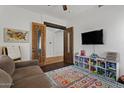 Bright playroom with toys, comfortable couch, and stylish decor, perfect for Gathering time at 1264 E Walnut Rd, Gilbert, AZ 85298