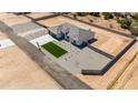 Aerial view of modern home, showcasing ample lot size and privacy fence at 18083 W Amber Dr, Goodyear, AZ 85338