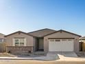 New construction home with a two-car garage and neutral exterior at 36893 W La Paz St, Maricopa, AZ 85138