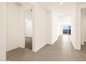 Bright hallway with tile flooring and access to other rooms at 36893 W La Paz St, Maricopa, AZ 85138
