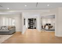 Light-filled entryway with hardwood floors and view of bedroom at 5919 N 45Th St, Phoenix, AZ 85018