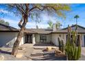 Inviting front entry with modern door and stone accents at 5919 N 45Th St, Phoenix, AZ 85018