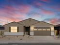 One-story house with brown garage door at 36914 W La Paz St, Maricopa, AZ 85138