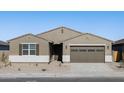One-story house with brown garage door at 36914 W La Paz St, Maricopa, AZ 85138