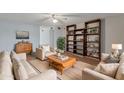Bright living room featuring comfortable seating and built-in shelving at 4121 W Medlock Dr, Phoenix, AZ 85019