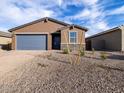 Charming single-story home with a blue garage door and a well-maintained front yard at 4256 W Jeanette Ln, San Tan Valley, AZ 85144