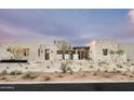 Attractive, modern home with stone accents and desert landscaping in a warm and inviting setting at 8386 E Leaning Rock Rd, Scottsdale, AZ 85266