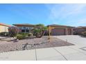 House exterior with two-car garage and desert landscaping at 19403 N Ponderosa Ct, Surprise, AZ 85387