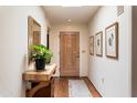 Bright entryway with hardwood floors and a tasteful console table at 6334 N 19Th St, Phoenix, AZ 85016