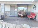 Inviting front porch with seating and decorative elements at 8203 E Nopal Ave, Mesa, AZ 85209