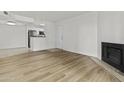 Open-concept living room with a fireplace and easy access to the kitchen at 3845 E Greenway Rd # 131, Phoenix, AZ 85032