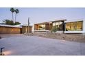Striking modern home with clean lines, desert landscaping, and ample parking space at 6623 N Hillside Dr, Paradise Valley, AZ 85253