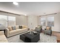 Bright living room with comfy seating and large windows at 8143 E Obispo Ave, Mesa, AZ 85212