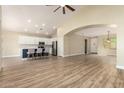 Open-concept living room featuring hardwood floors and seamless flow into the kitchen and dining areas at 2156 E Aloe Pl, Chandler, AZ 85286