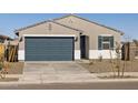 One-story home with a dark gray garage door and light colored exterior at 16006 W Cottontail Ln, Surprise, AZ 85387