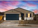A charming one-story home with a two-car garage at 16006 W Cottontail Ln, Surprise, AZ 85387