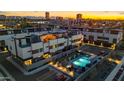 Community aerial view featuring a modern townhouse complex with a pool and well-maintained landscaping at 377 E Windsor Ave # 21, Phoenix, AZ 85004