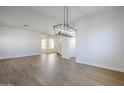 Spacious dining room, hardwood floors, view into Gathering room and kitchen at 718 E Scorpio Pl, Chandler, AZ 85249